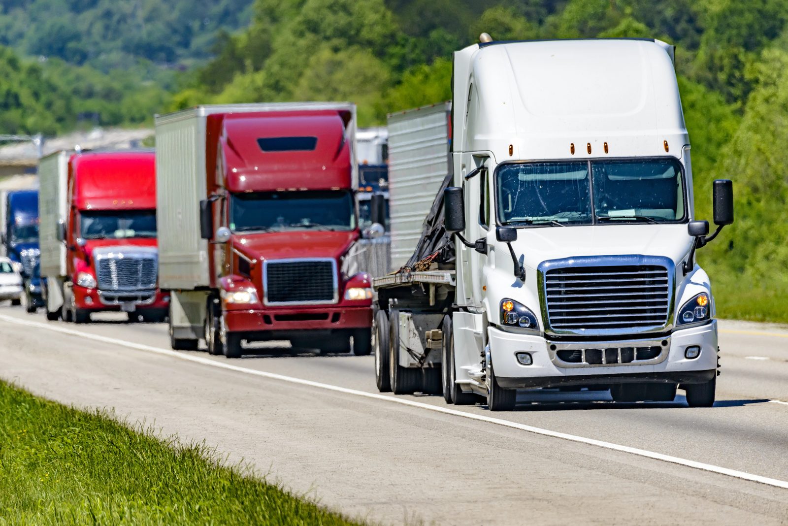 Line of 18-wheelers traveling Interstate 40 near West Memphis, Arkansas