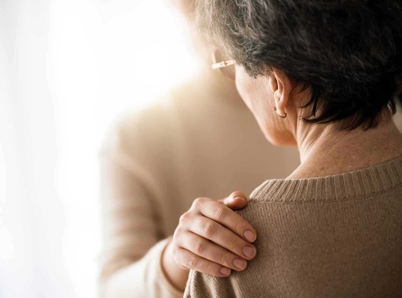 A comforting hand on a grieving woman’s shoulder — Southern Injury Attorneys helps Dallas families after a wrongful death.
