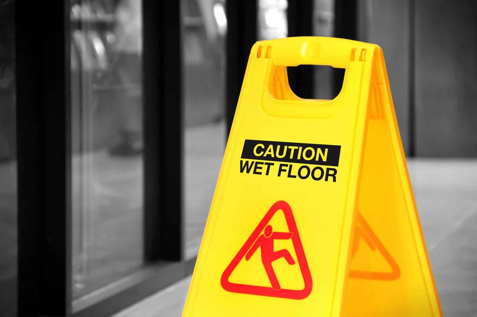 Yellow wet floor caution sign marking a slip-and-fall hazard