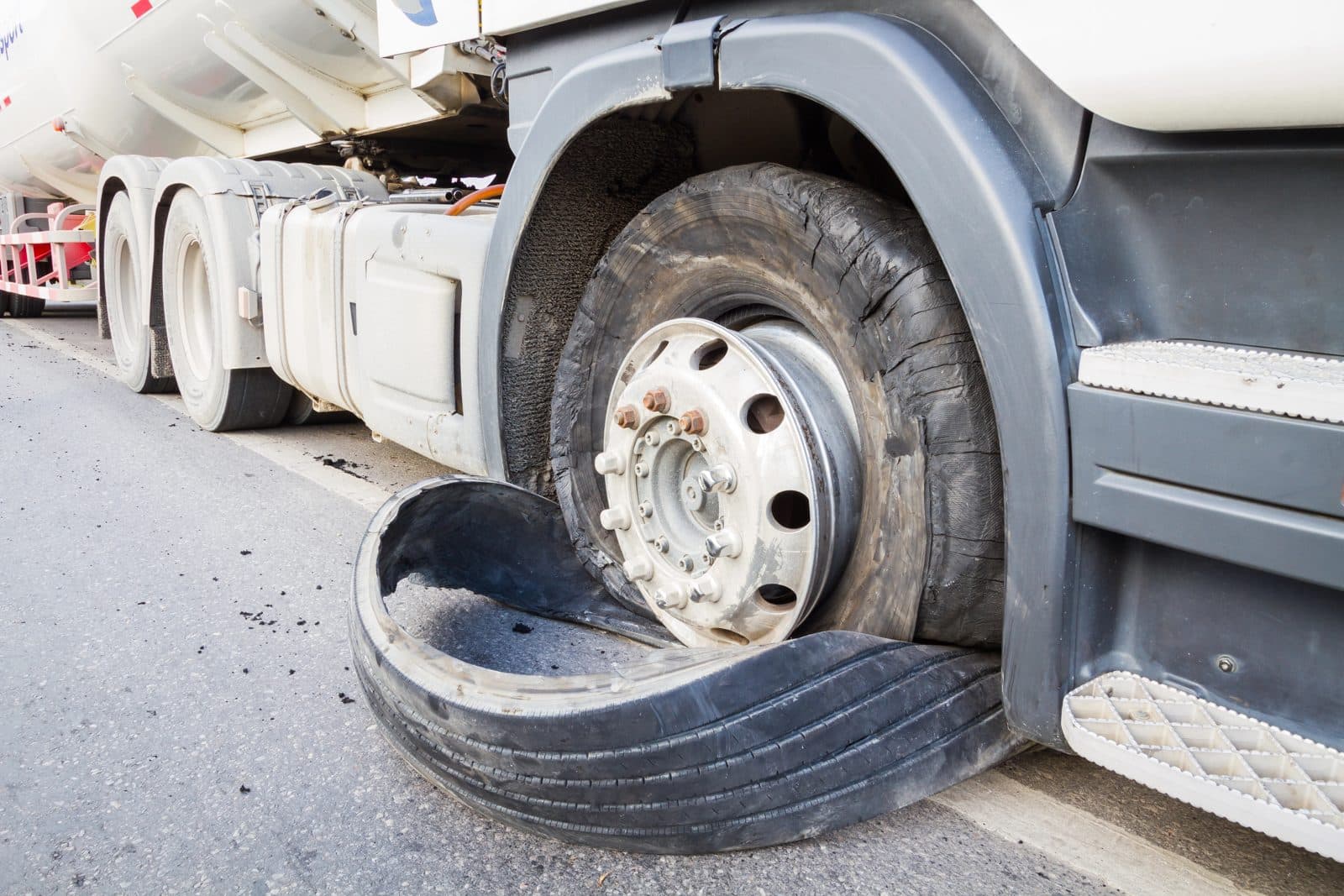 Damaged 18-wheeler with burst tires on a highway near Louisville, Kentucky.