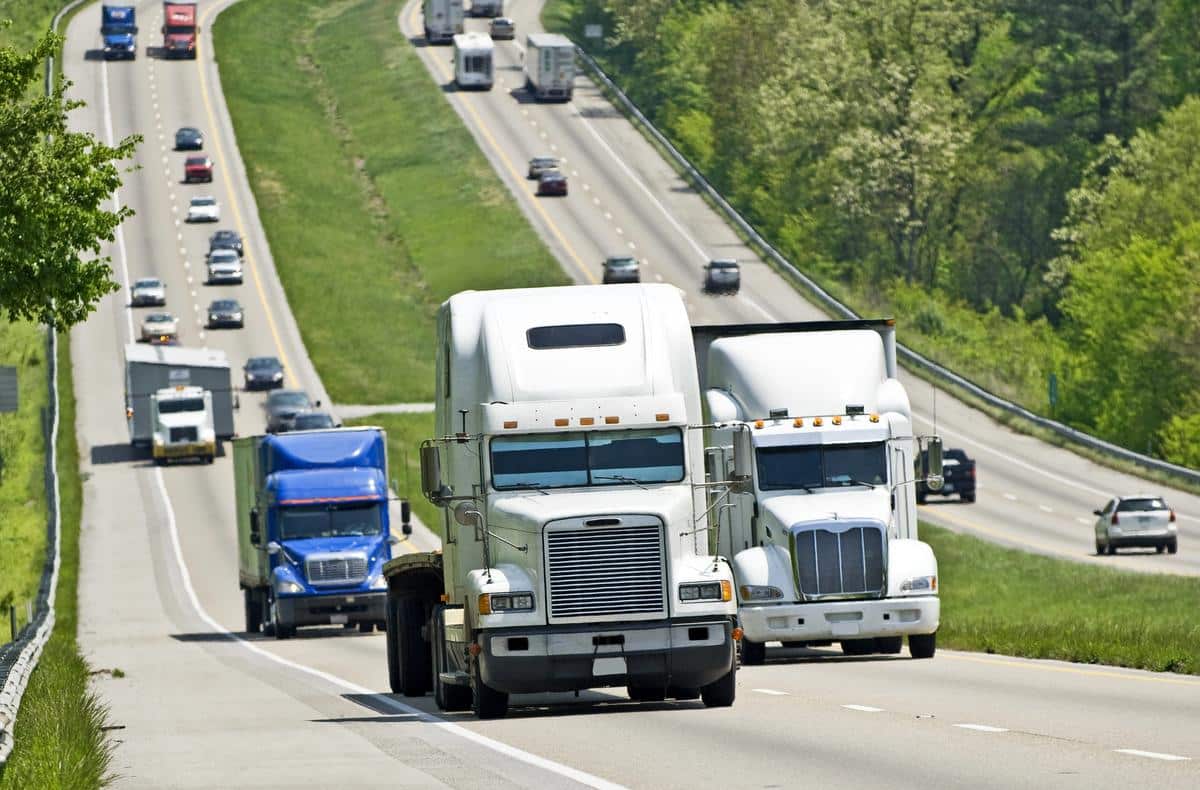 Tractor-trailers and cars traveling the US-78 / Interstate 22 freight corridor near Olive Branch, Mississippi