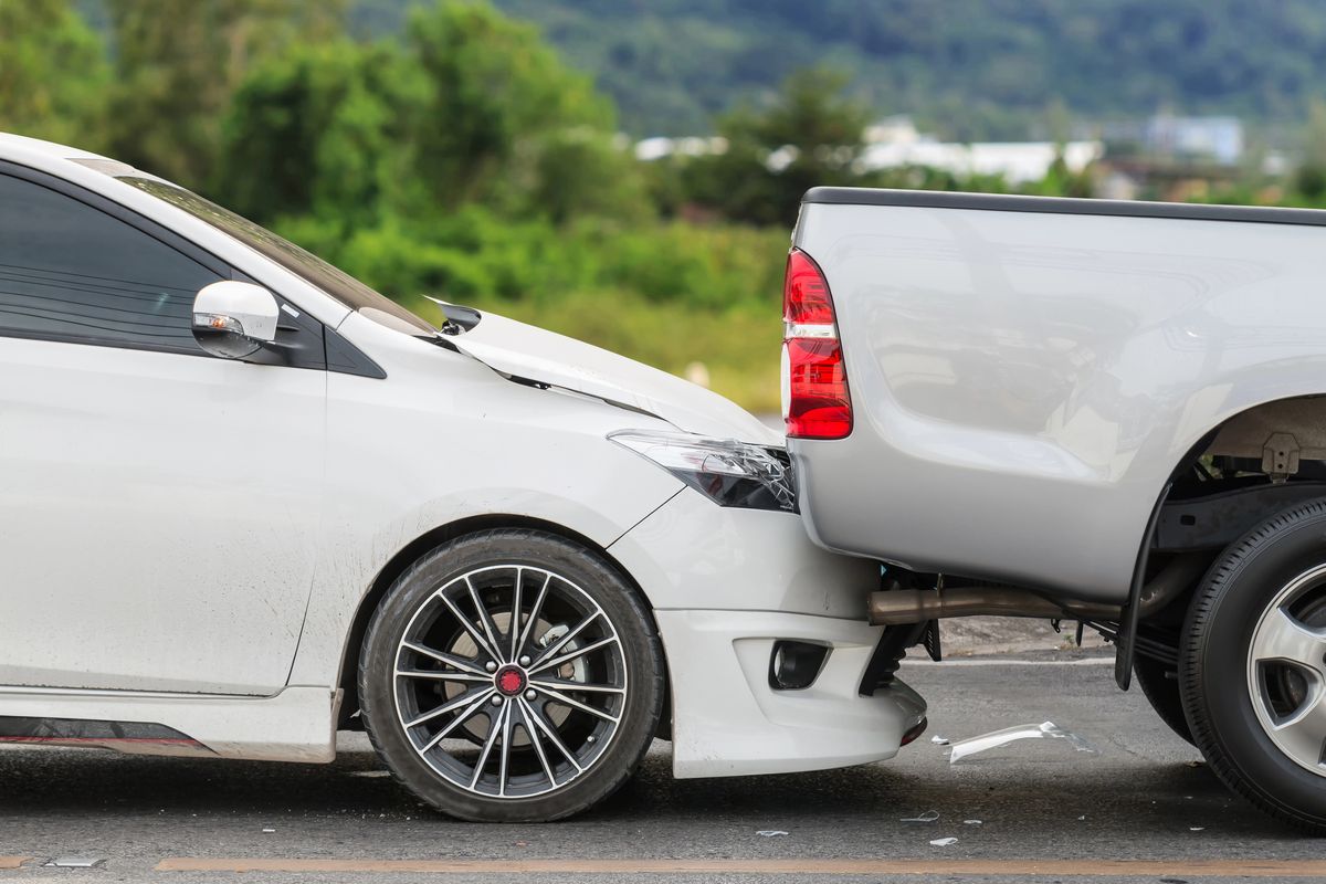 Front of a car crashed into the back of a pickup truck in a rear-end collision in Olive Branch, Mississippi