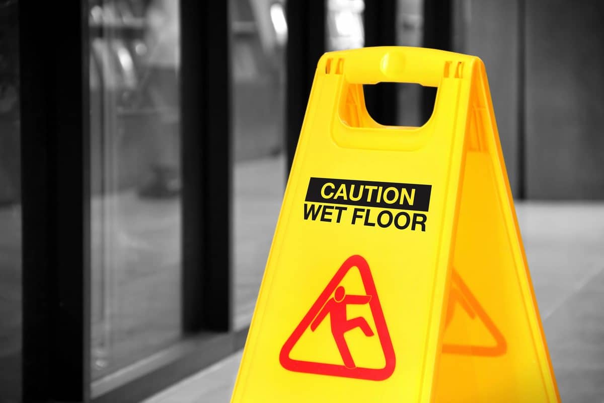 Yellow wet-floor caution sign warning of a slip-and-fall hazard in Southaven, Mississippi