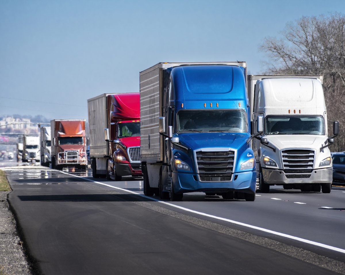 Convoy of 18-wheelers on an interstate highway near Southaven, Mississippi