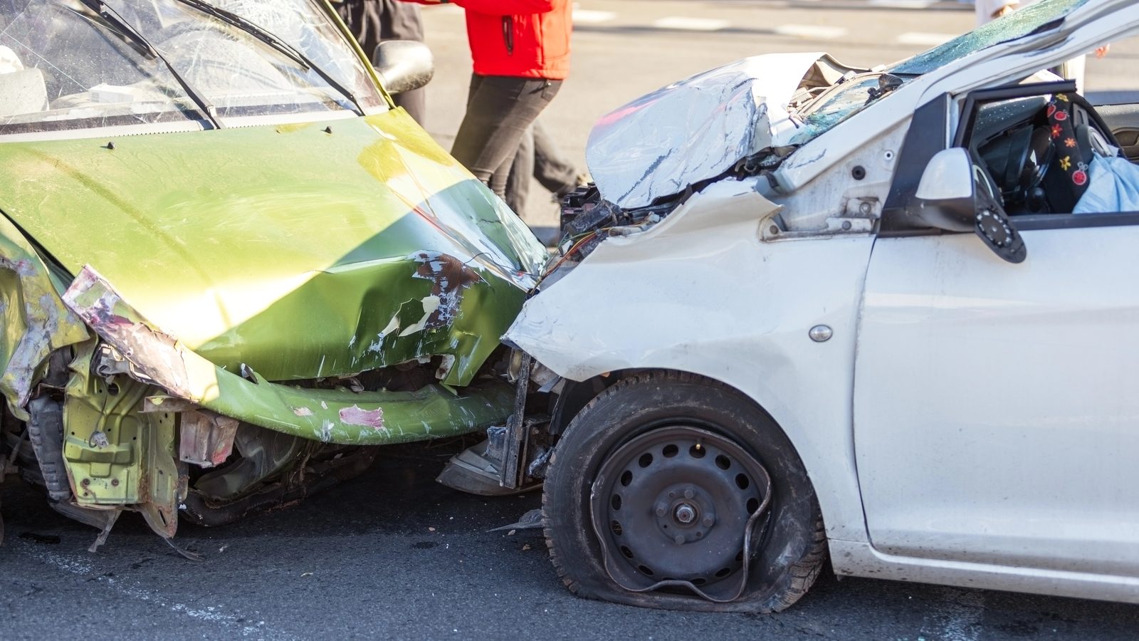 Two cars with severe front-end damage after an intersection collision like those on Caraway Road and Highland Drive in Jonesboro, Arkansas